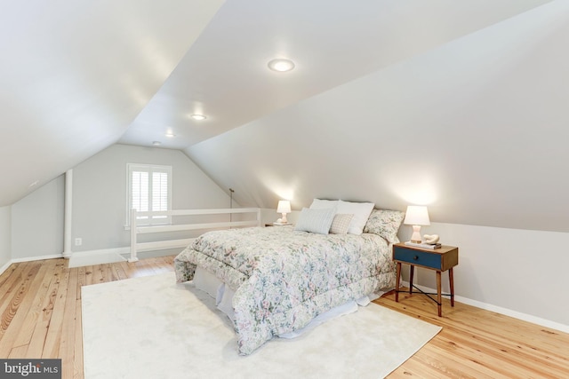 3703 Thornapple St, Chevy Chase, MD 20815 - bedroom featuring wood finished floors, baseboards, and vaulted ceiling