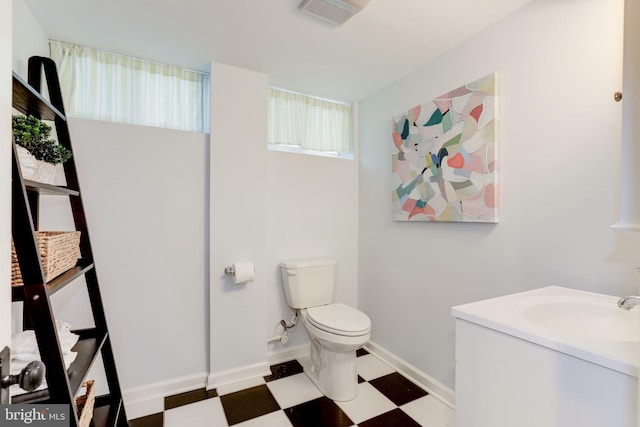 3703 Thornapple St, Chevy Chase, MD 20815 - bathroom with tile patterned floors, toilet, vanity, and baseboards