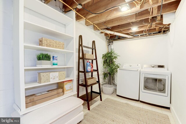 3703 Thornapple St, Chevy Chase, MD 20815 - washroom featuring washer and clothes dryer and tile patterned floors