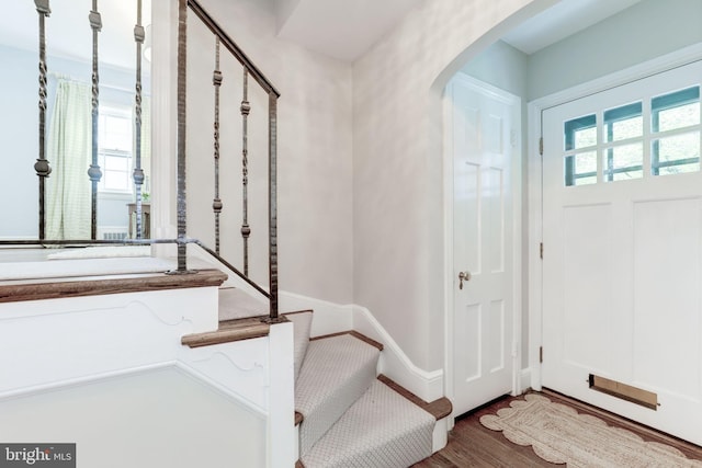 3703 Thornapple St, Chevy Chase, MD 20815 - entrance foyer featuring arched walkways and wood finished floors