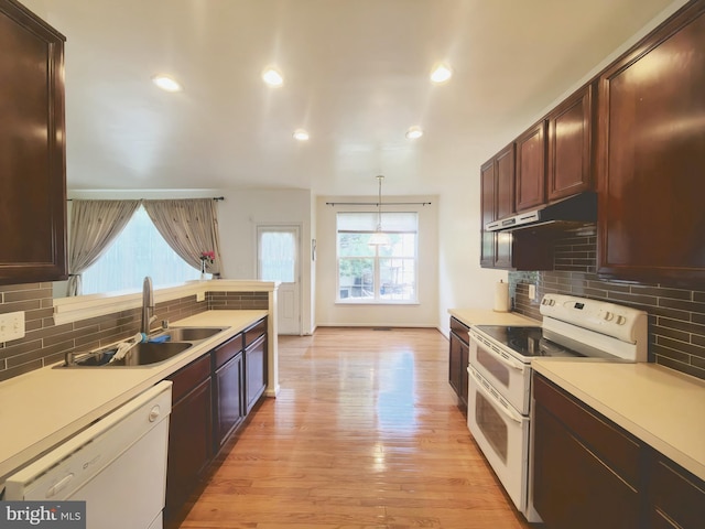 35547 Sarasota St, Round Hill, VA 20141 - kitchen with white appliances, under cabinet range hood, light countertops, backsplash, and recessed lighting