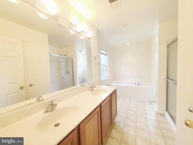 35547 Sarasota St, Round Hill, VA 20141 - full bathroom featuring tile patterned floors, a shower stall, a bath, and double vanity