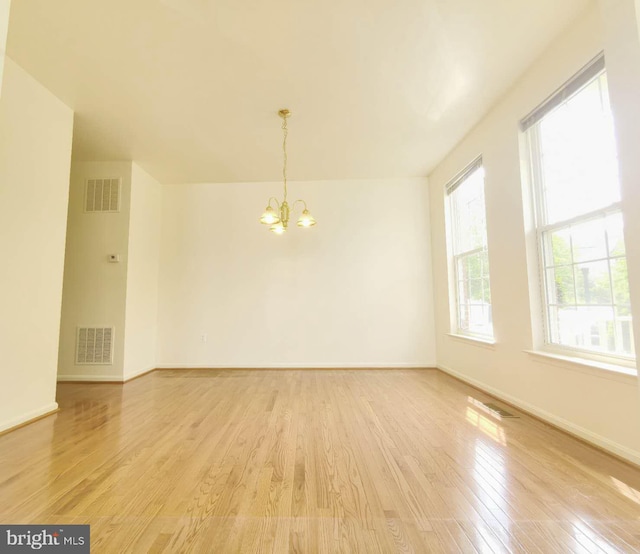 35547 Sarasota St, Round Hill, VA 20141 - empty room with a chandelier, light wood-style floors, and baseboards