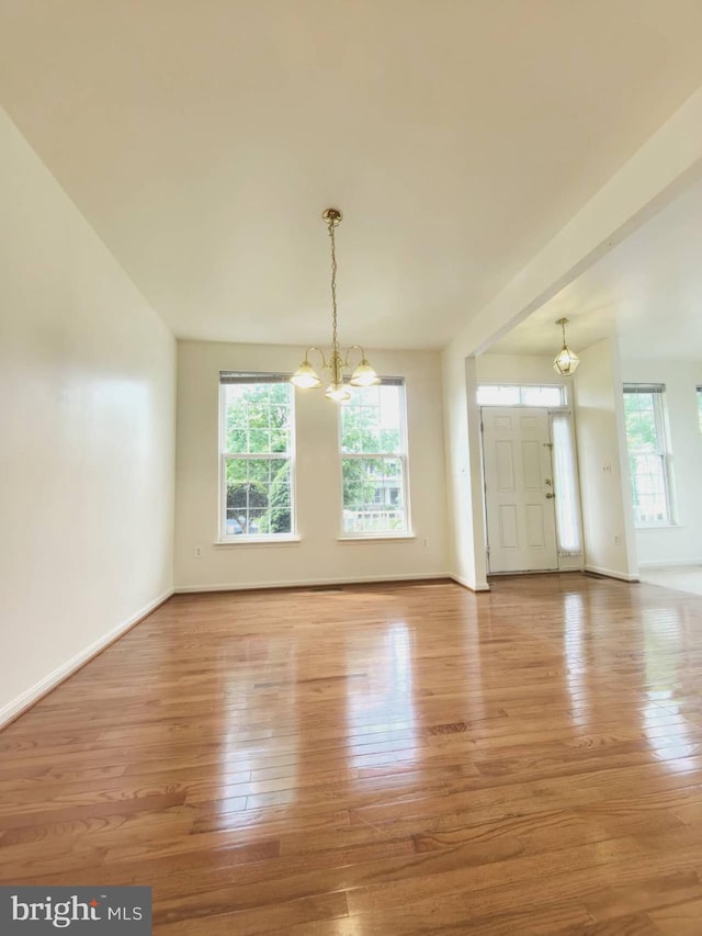 35547 Sarasota St, Round Hill, VA 20141 - empty room with a chandelier, light wood-style floors, and baseboards