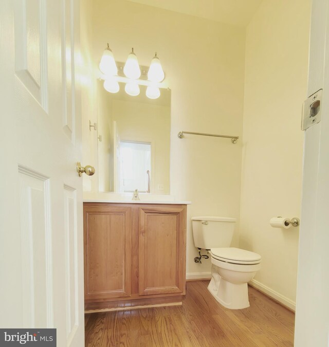 35547 Sarasota St, Round Hill, VA 20141 - bathroom with wood finished floors, vanity, toilet, and baseboards
