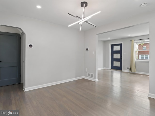 610 Galveston Pl SE, Washington, DC 20032 - spare room featuring wood finished floors, recessed lighting, arched walkways, baseboards, and a smoke detector