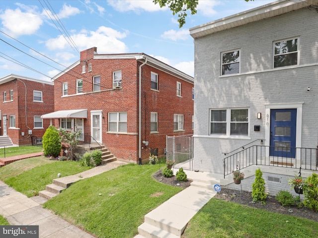 610 Galveston Pl SE, Washington, DC 20032 - view of front of house featuring brick siding and a front lawn