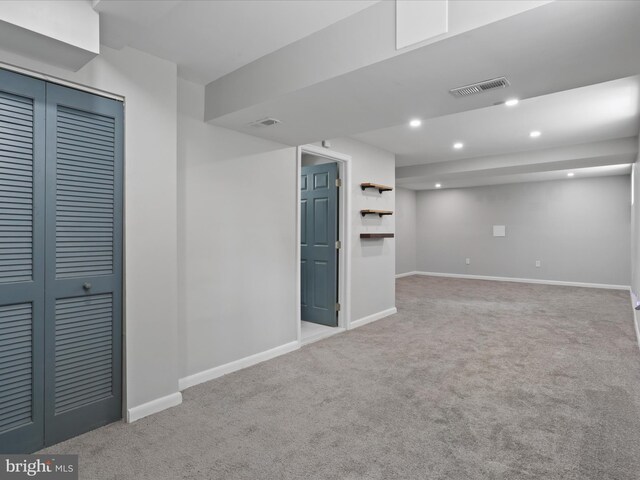 610 Galveston Pl SE, Washington, DC 20032 - finished below grade area with carpet, baseboards, and recessed lighting