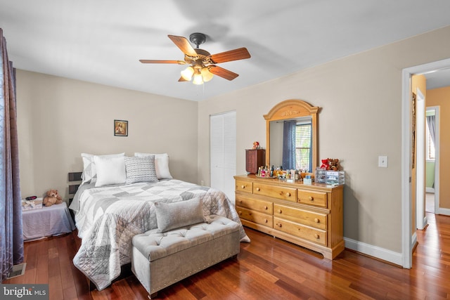 8262 Amity Cir, Gaithersburg, MD 20877 - bedroom featuring wood-type flooring, a closet, ceiling fan, and baseboards