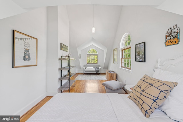 2937 Fort Baker Dr SE, Washington, DC 20020 - bedroom featuring wood finished floors, baseboards, and high vaulted ceiling