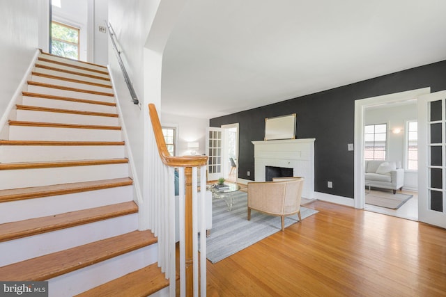 2937 Fort Baker Dr SE, Washington, DC 20020 - stairway featuring wood finished floors and a brick fireplace