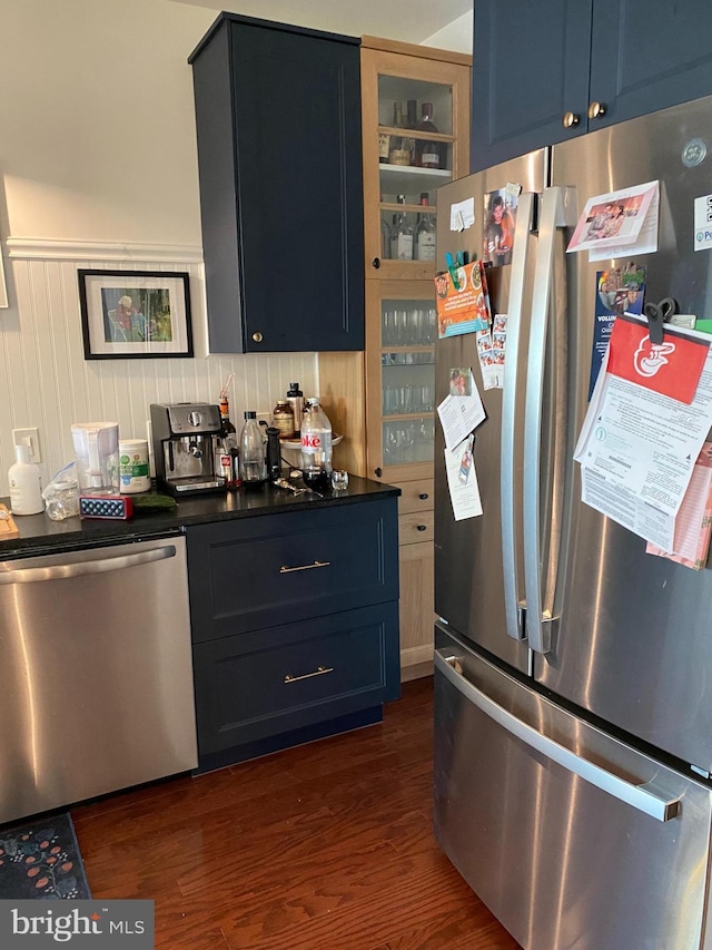 100 Harborview Unit 2307, Baltimore, MD 21230 - kitchen with appliances with stainless steel finishes, dark wood-type flooring, glass insert cabinets, dark countertops, and blue cabinets