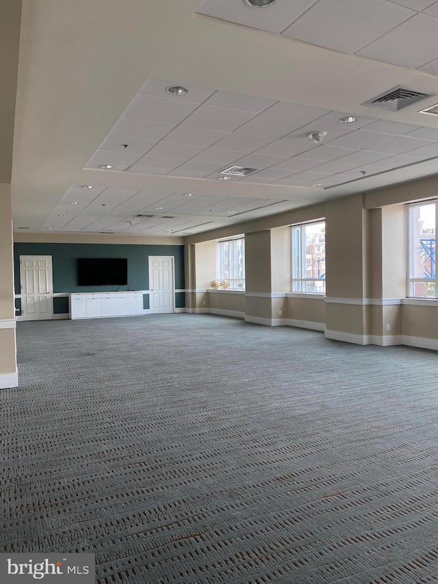 100 Harborview Unit 2307, Baltimore, MD 21230 - unfurnished room featuring carpet, baseboards, plenty of natural light, and a paneled ceiling