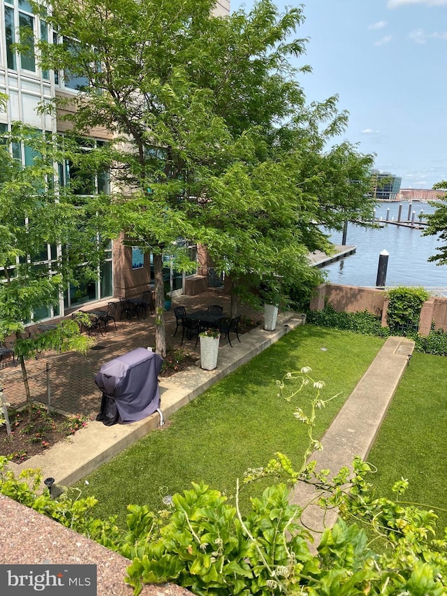100 Harborview Unit 2307, Baltimore, MD 21230 - view of grassy yard featuring a water view, a patio area, and a boat dock