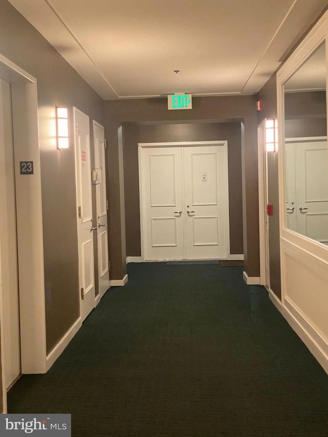 100 Harborview Unit 2307, Baltimore, MD 21230 - hallway with baseboards and dark carpet