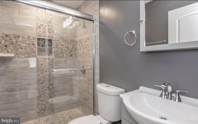 119 S Conkling St, Baltimore, MD 21224 - bathroom with toilet, a shower stall, and vanity