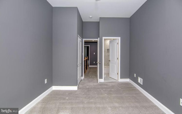 119 S Conkling St, Baltimore, MD 21224 - unfurnished bedroom featuring carpet floors, baseboards, and ensuite bath