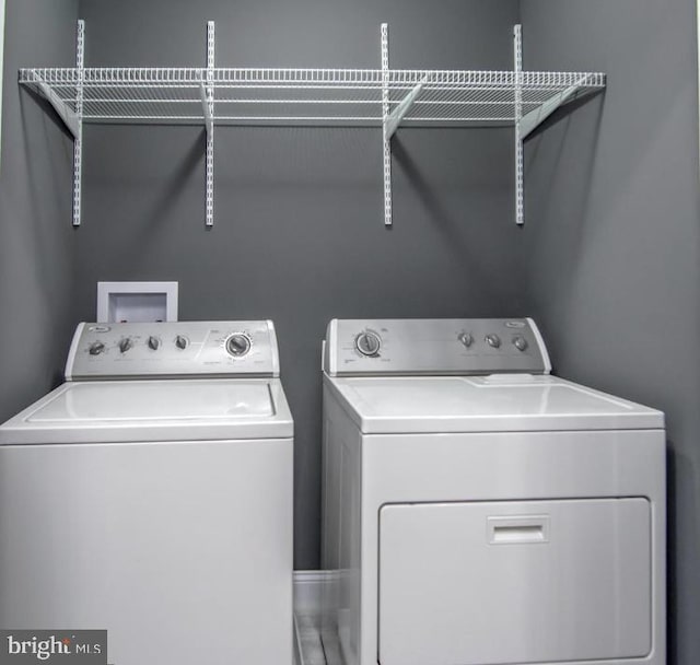 119 S Conkling St, Baltimore, MD 21224 - laundry area featuring separate washer and dryer