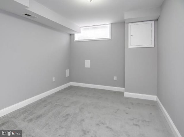 119 S Conkling St, Baltimore, MD 21224 - below grade area featuring carpet floors and baseboards