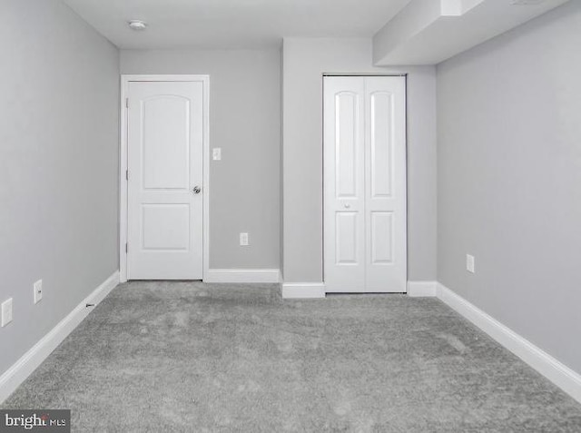 119 S Conkling St, Baltimore, MD 21224 - unfurnished bedroom with carpet flooring, a closet, and baseboards