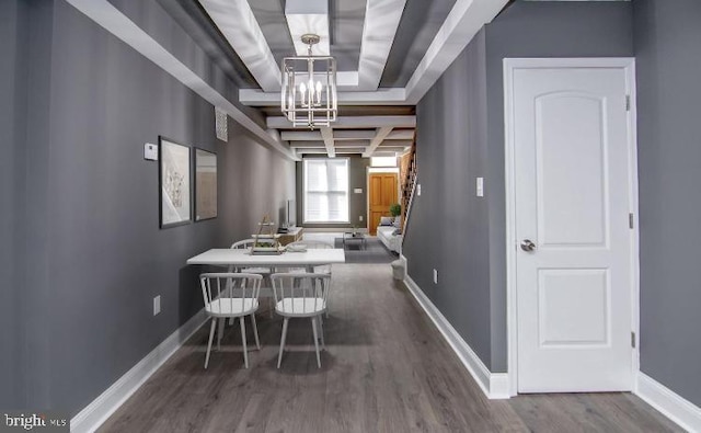 119 S Conkling St, Baltimore, MD 21224 - dining room featuring wood finished floors, a chandelier, and baseboards