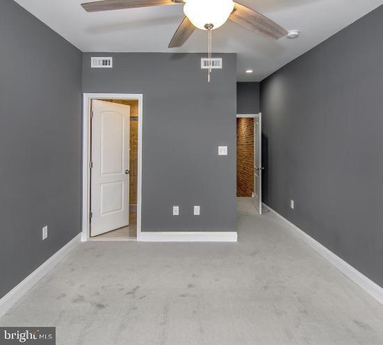 119 S Conkling St, Baltimore, MD 21224 - unfurnished bedroom with carpet flooring and baseboards