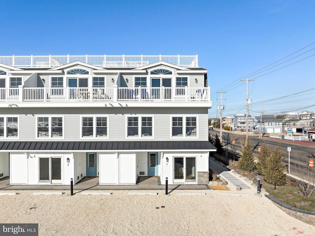 2600 Long Beach Blvd Unit 6, Long Beach Township, NJ 08008 - view of front of house with a standing seam roof, metal roof, and a balcony