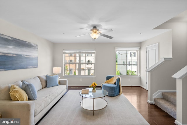 9950 Ravenhurst Rd, Middle River, MD 21220 - living room with dark wood-style floors, stairway, and a ceiling fan