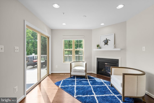 9950 Ravenhurst Rd, Middle River, MD 21220 - sitting room featuring wood finished floors, a glass covered fireplace, and recessed lighting