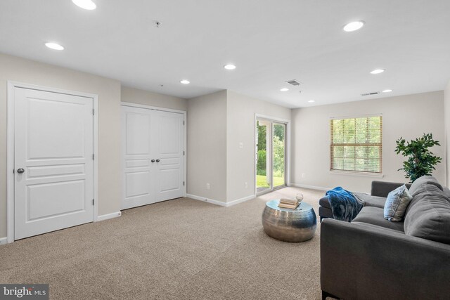 9950 Ravenhurst Rd, Middle River, MD 21220 - living area featuring light carpet and recessed lighting