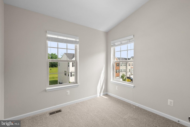9950 Ravenhurst Rd, Middle River, MD 21220 - carpeted empty room featuring baseboards and lofted ceiling