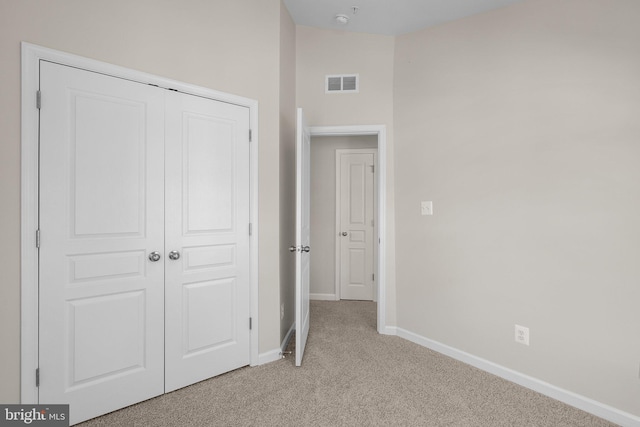 9950 Ravenhurst Rd, Middle River, MD 21220 - unfurnished bedroom with light colored carpet and a closet