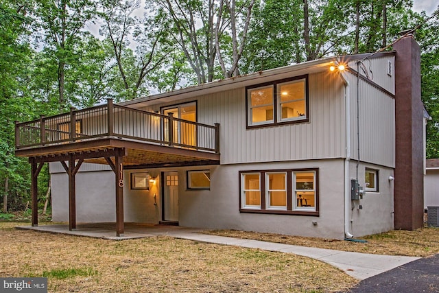 118 Bock Ave, Wenonah, NJ 08090 - view of front of property featuring a wooden deck, a patio, a chimney, and cooling unit