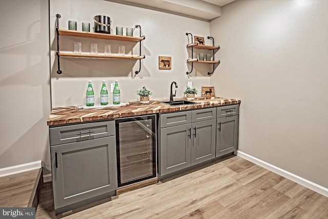 118 Bock Ave, Wenonah, NJ 08090 - indoor wet bar featuring beverage cooler, light wood-style flooring, and baseboards