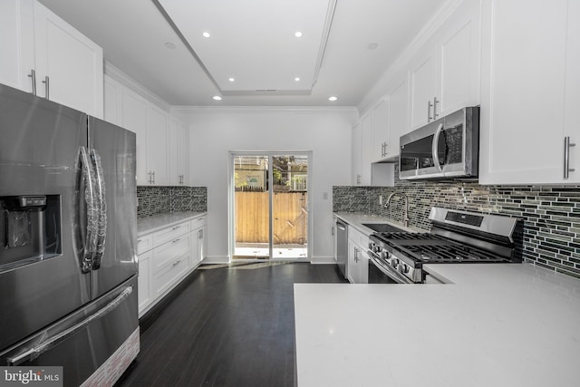 1327 S Hollywood St, Philadelphia, PA 19146 - kitchen featuring appliances with stainless steel finishes, a sink, light countertops, recessed lighting, and white cabinets