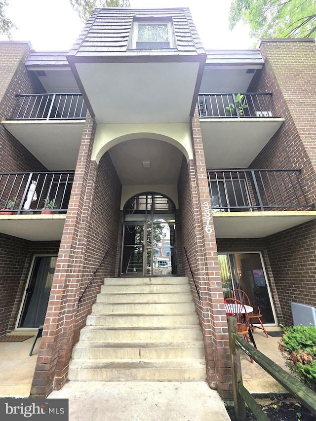 3376 Woodburn Rd, Annandale, VA 22003 - doorway to property featuring brick siding