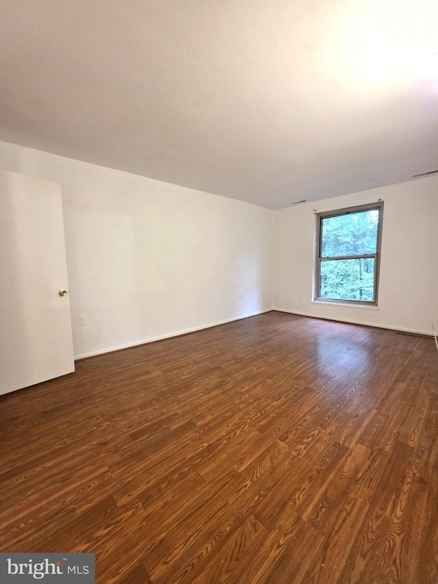 3376 Woodburn Rd, Annandale, VA 22003 - spare room with dark wood-type flooring