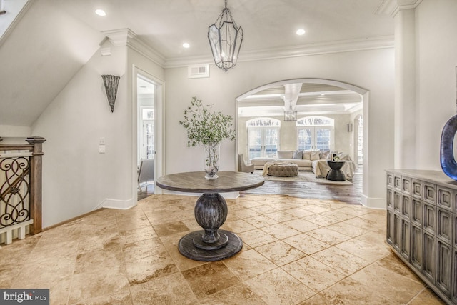 5420 Moorland Ln, Bethesda, MD 20814 - foyer featuring arched walkways, baseboards, recessed lighting, and ornamental molding