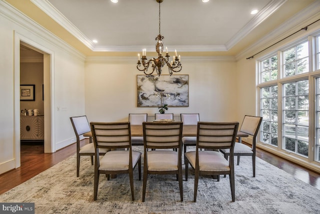 5420 Moorland Ln, Bethesda, MD 20814 - dining room with a chandelier, wood finished floors, crown molding, a tray ceiling, and baseboards