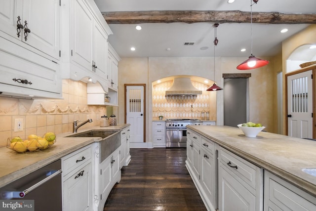 5420 Moorland Ln, Bethesda, MD 20814 - kitchen featuring stainless steel appliances, white cabinetry, a sink, tasteful backsplash, and dark wood-style flooring