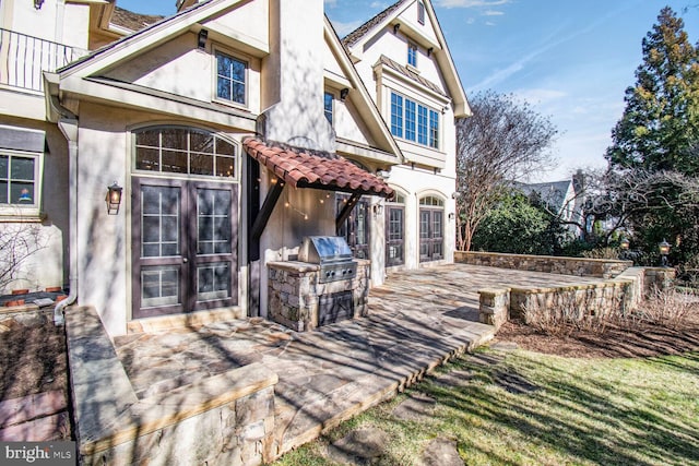 5420 Moorland Ln, Bethesda, MD 20814 - back of property featuring stucco siding, area for grilling, and french doors
