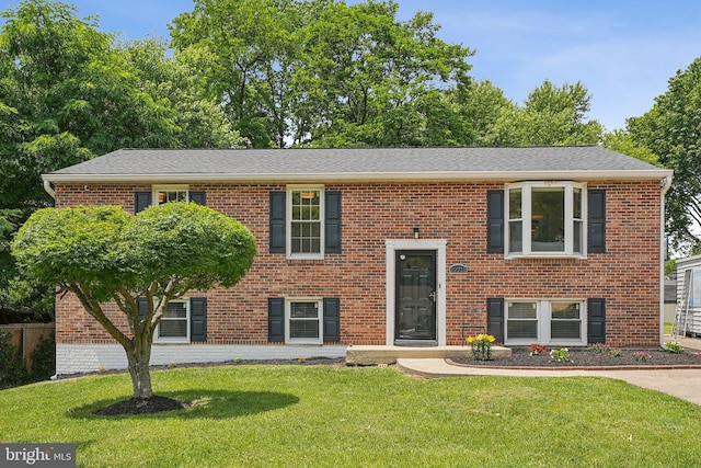 12711 Lampton Ln, Fort Washington, MD 20744 - bi-level home with a front lawn, brick siding, and a shingled roof