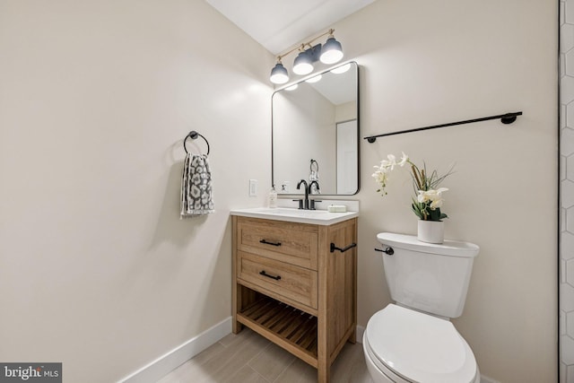 12711 Lampton Ln, Fort Washington, MD 20744 - bathroom featuring baseboards, toilet, and vanity