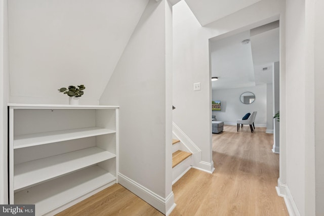 12711 Lampton Ln, Fort Washington, MD 20744 - hall featuring light wood-style floors, stairs, baseboards, and vaulted ceiling