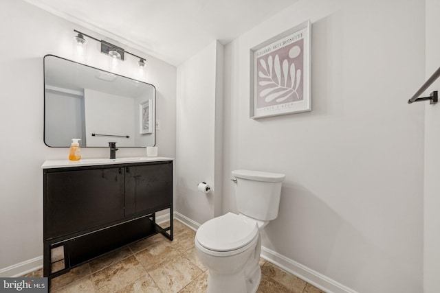 12711 Lampton Ln, Fort Washington, MD 20744 - bathroom featuring baseboards, toilet, and vanity