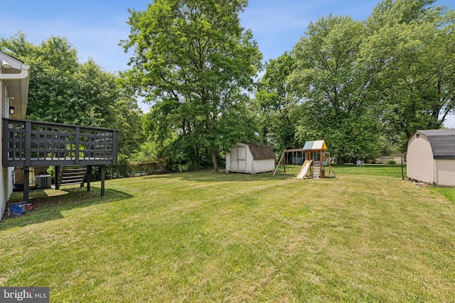 12711 Lampton Ln, Fort Washington, MD 20744 - view of green lawn with cooling unit, a playground, and a wooden deck