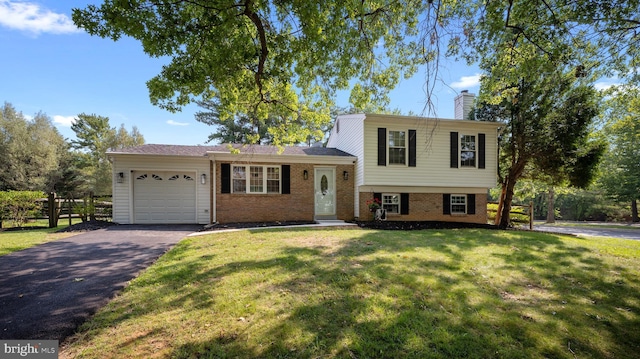 13413 Winterspoon Ln, Germantown, MD 20874 - tri-level home with an attached garage, driveway, brick siding, a chimney, and a front yard