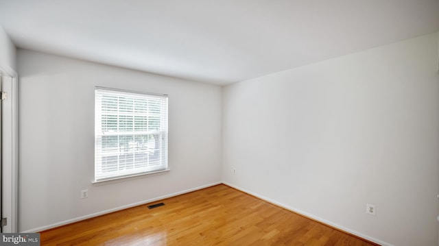 13413 Winterspoon Ln, Germantown, MD 20874 - spare room with wood finished floors and baseboards