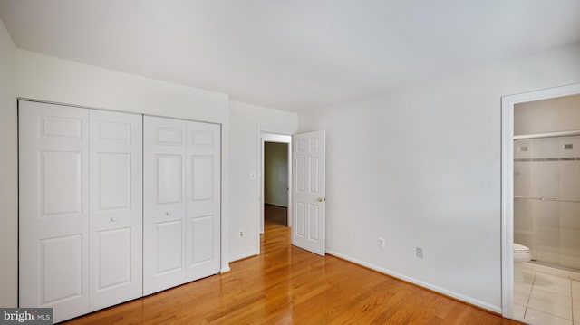 13413 Winterspoon Ln, Germantown, MD 20874 - unfurnished bedroom with a closet, light wood-style floors, and ensuite bathroom