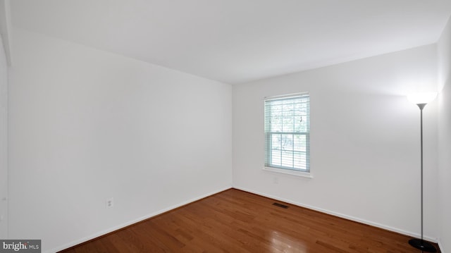 13413 Winterspoon Ln, Germantown, MD 20874 - spare room featuring wood finished floors and baseboards